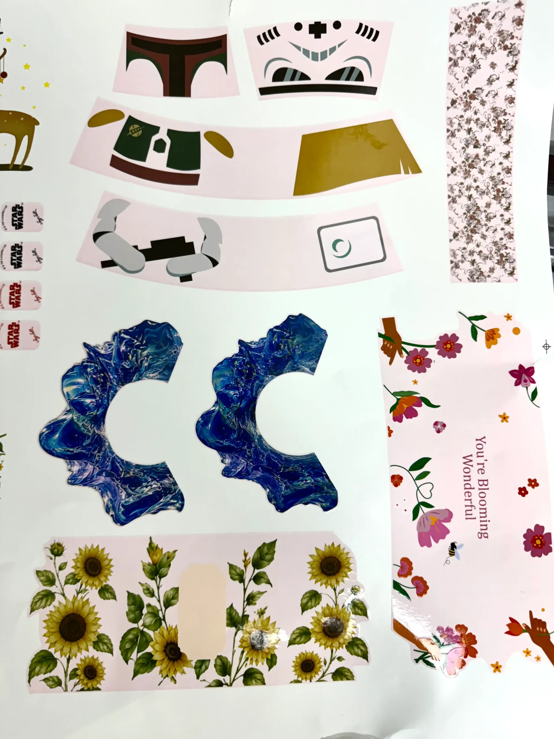 Contoured and floral waterslide decal artwork laid out by shape on a print sheet